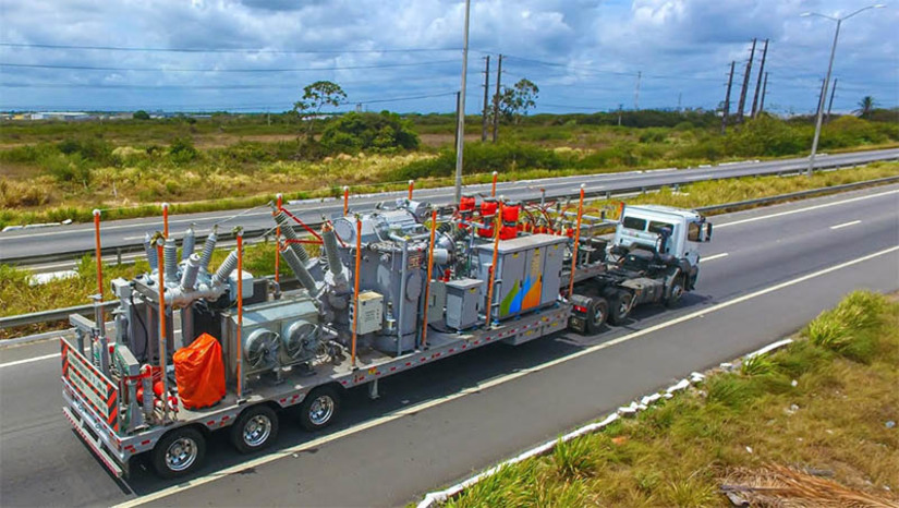 Imagem 1 -  Neoenergia Cosern reforça sistema elétrico em cerca de 30 municípios do litoral do RN. Ao todo, a Companhia investiu R$ 80 milhões, com o objetivo de garantir o pleno fornecimento de energia aos potiguares e turistas durante a temporada de verão. Entre os destaques do Plano, está a entrada em operação da quarta Subestação Móvel, que é uma central de distribuição de energia montada em uma carreta de seis eixos utilizada para realizar manutenções corretivas, preventivas, obras de reforço e atendimentos emergenciais nas 76 Subestações “fixas” da distribuidora espalhadas pelo estado.