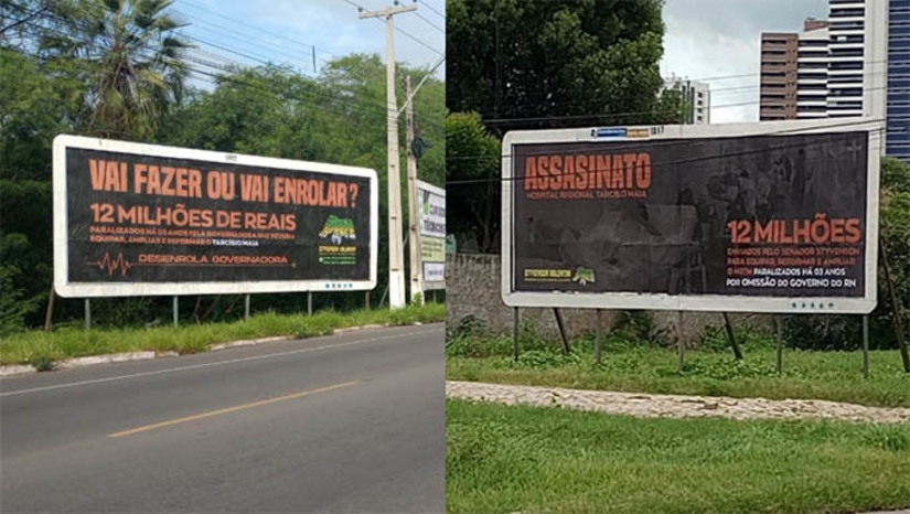 Imagem 1 -  Styvenson Valentin destinou mais de R$ 12 milhões para o Governo do Estado investir na estruturação do Hospital Regional Tarcísio Maia, em Mossoró-RN, porém, passados 3 anos desta destinação de recursos federais através de emendas, os recursos ainda não foram aplicados, o que segundo os outdoors resulta em mortes, "ASSASINATO". "VAI FAZER OU VAI ENROLAR?", pergunta a peça publicitária instalada em Mossoró-RN. Veja o que diz o Governo do Estado, em Nota..